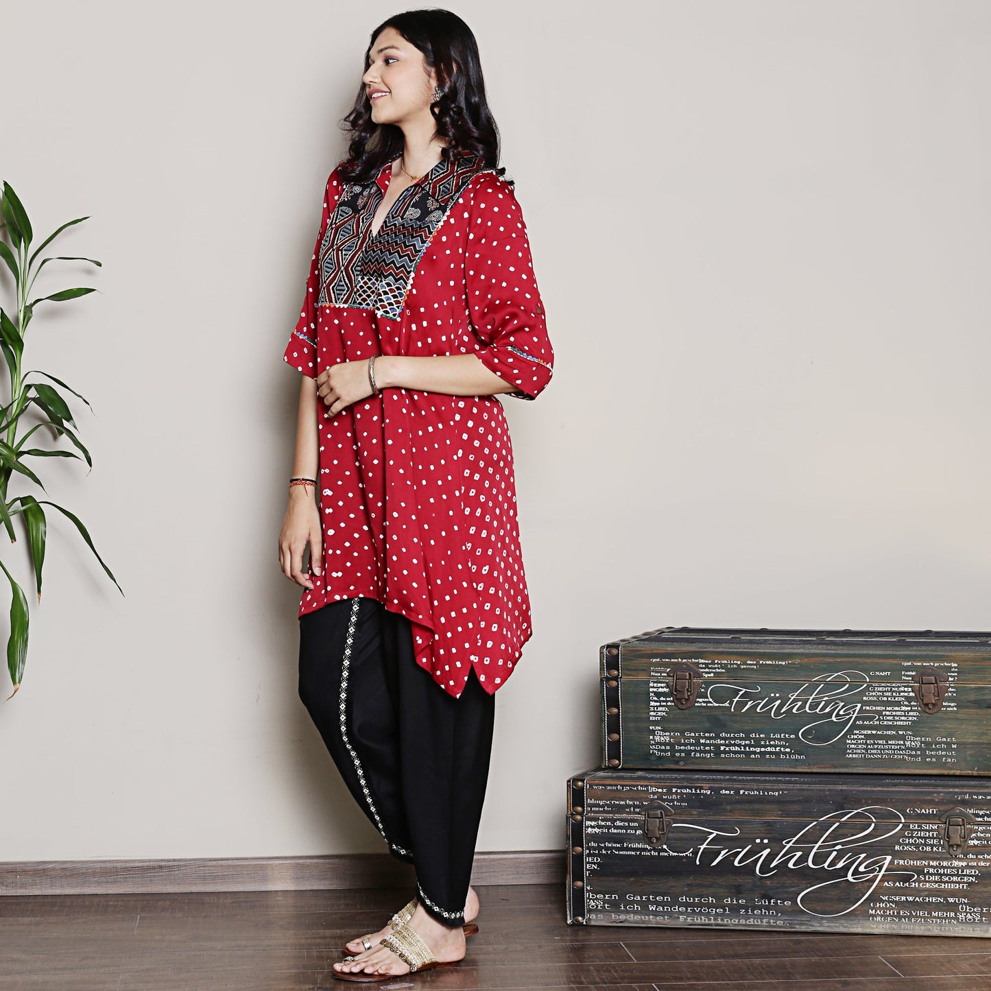 Bandhani asymmetric kurta with yoke detailing.