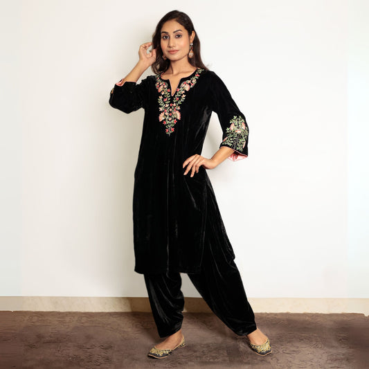 Black hand embroidered velvet kurta set with salwar.