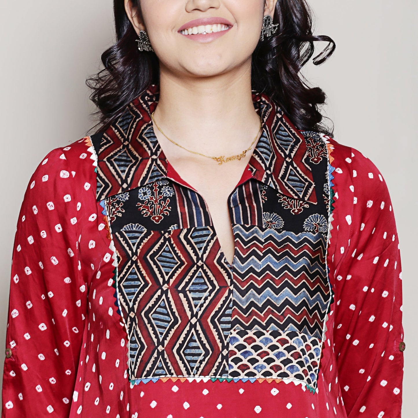 Bandhani asymmetric kurta with yoke detailing.