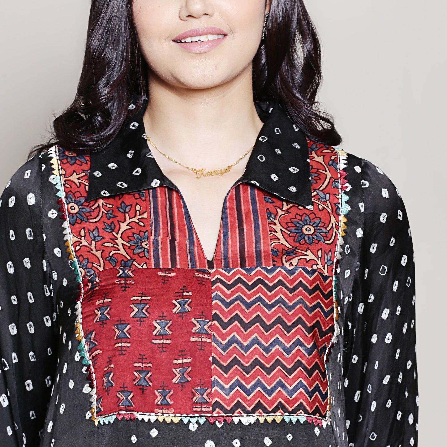 Bandhani asymmetric kurta with yoke detailing.