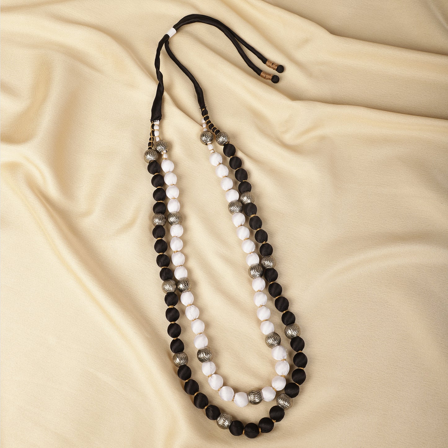 Black and white satin necklace close-up - Spring Soul
