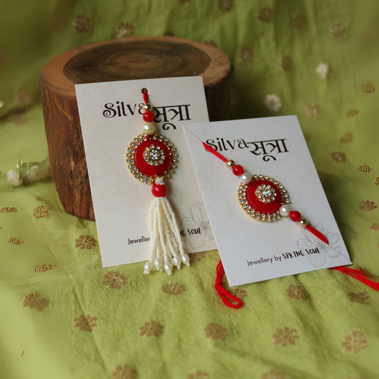 Red studded rakhi set of 2