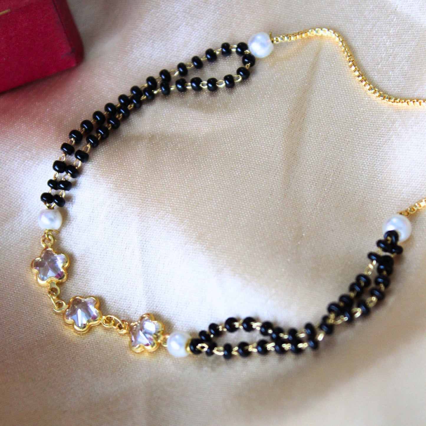 Black bead floral bracelet rakhi