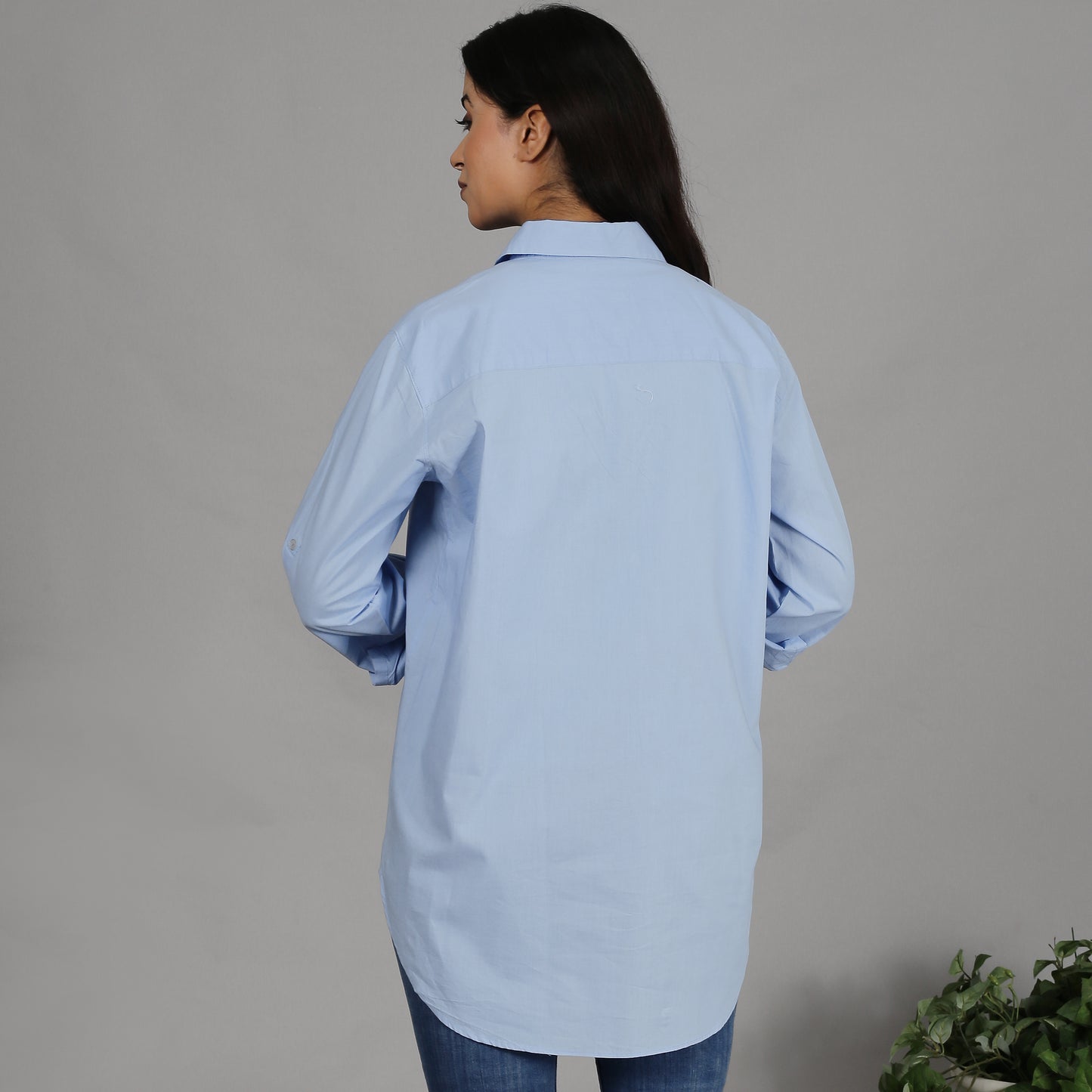 Blue shirt with floral embroidery on the pocket