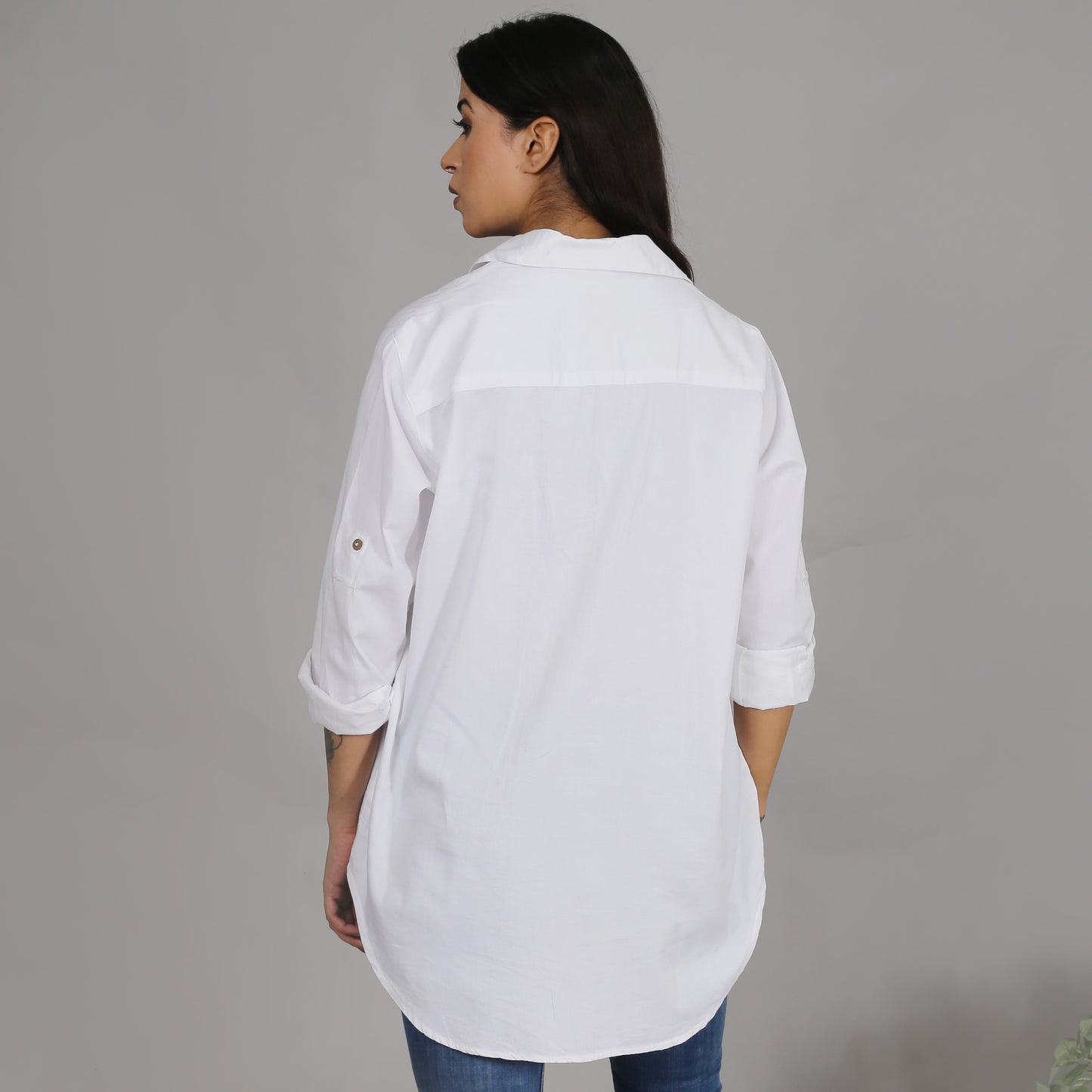 White shirt with floral embroidery on the pocket