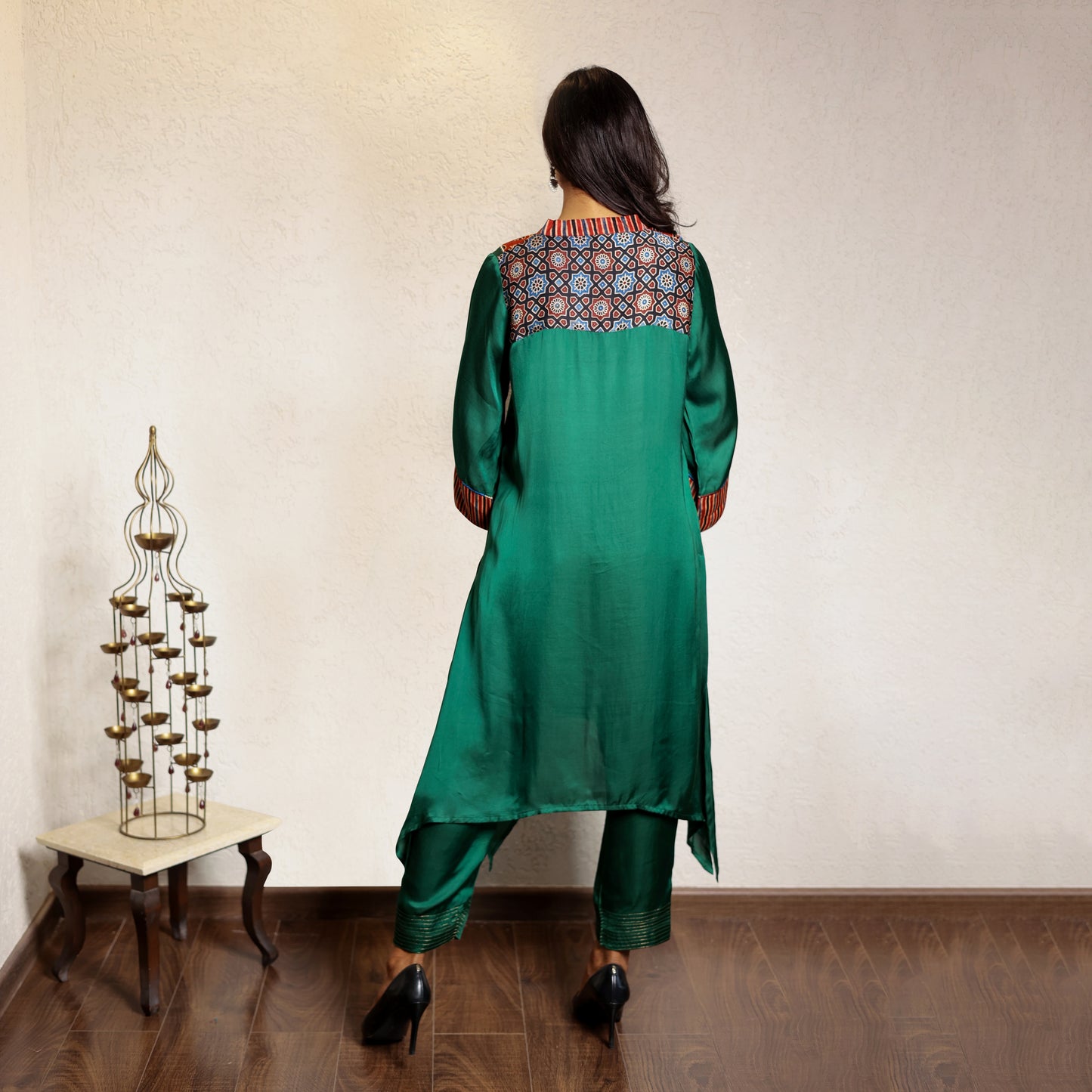 Green asymmetric modal silk kurta set with ajrakh yolk detailing
