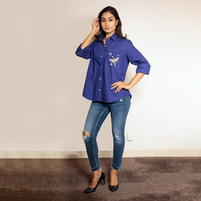 Blue shirt with dragonfly embroidery on the pocket
