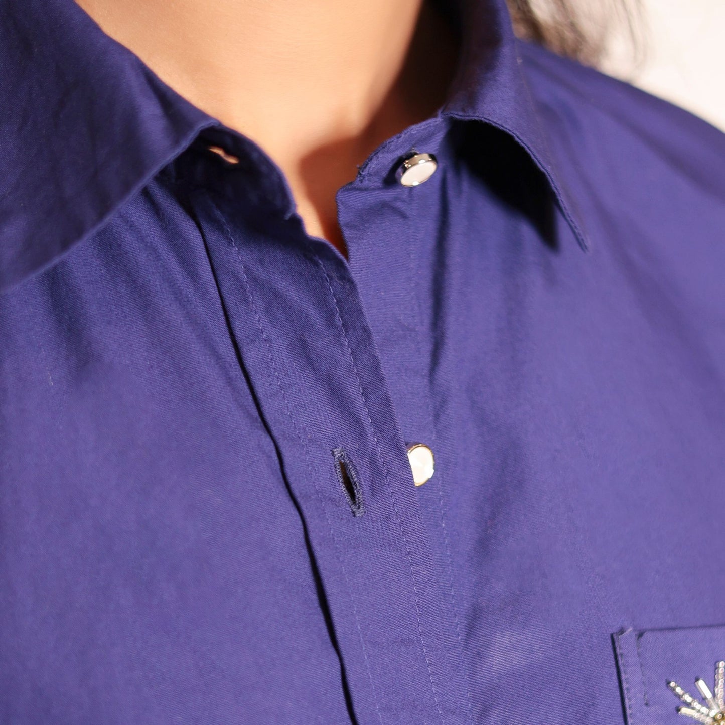 Blue shirt with dragonfly embroidery on the pocket