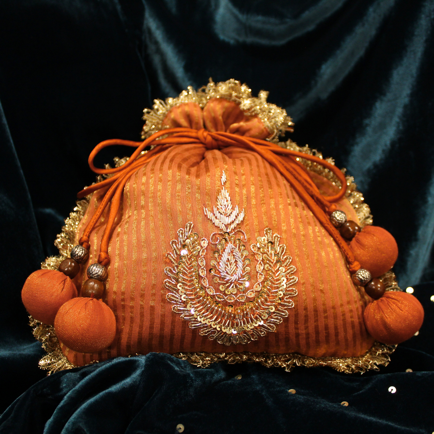 Orange Tissue Chanderi hand embroidered Potli bag