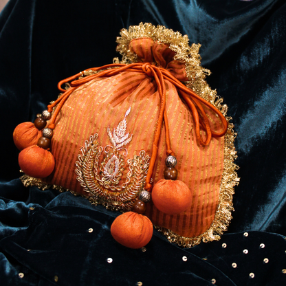 Orange Tissue Chanderi hand embroidered Potli bag