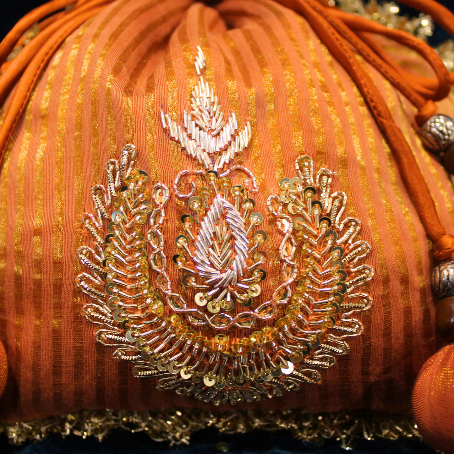 Orange Tissue Chanderi hand embroidered Potli bag
