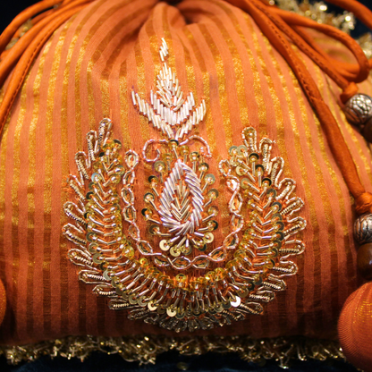 Orange Tissue Chanderi hand embroidered Potli bag
