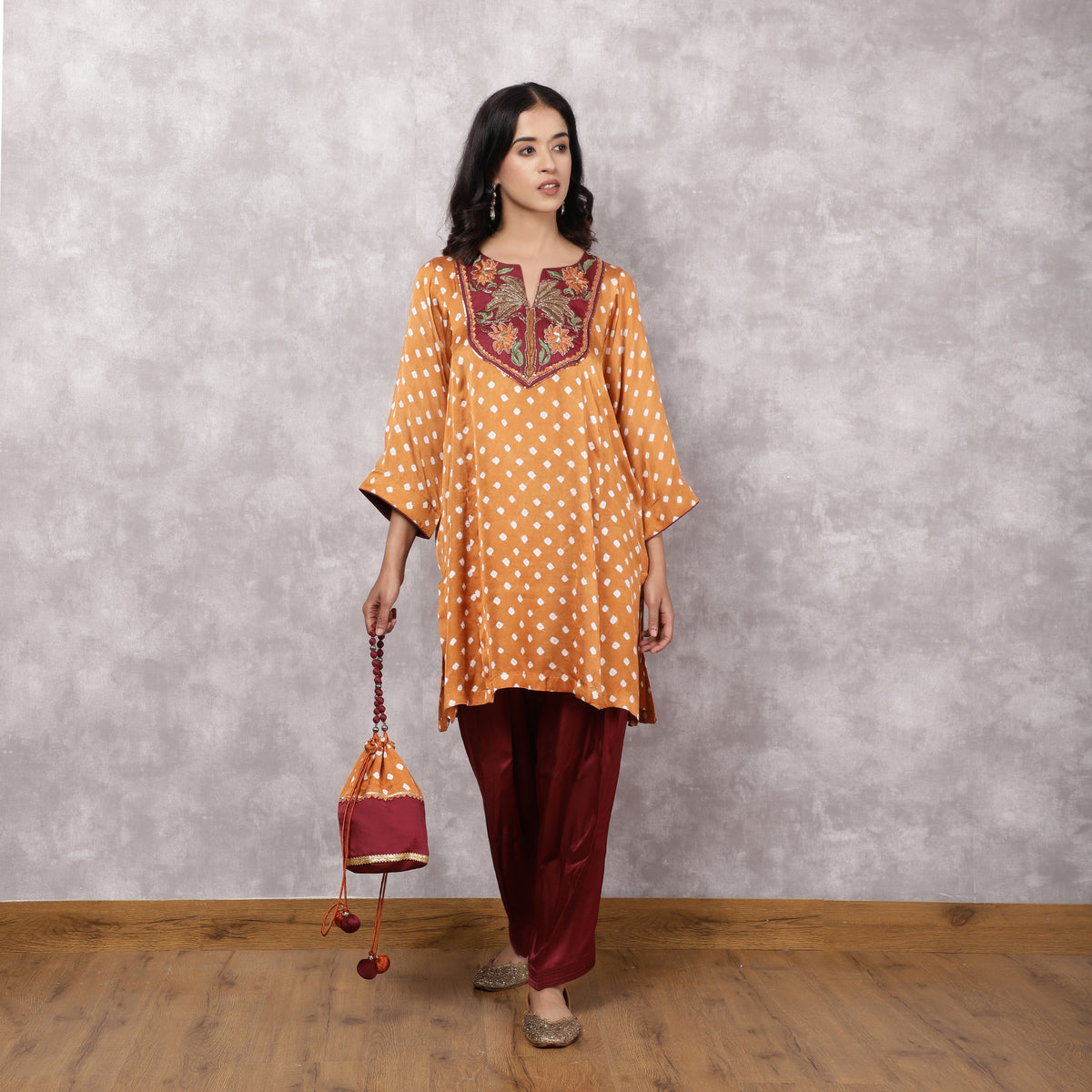 Orange Bandhani Suit Set with Hand Embroidered Yoke and Potli Bag