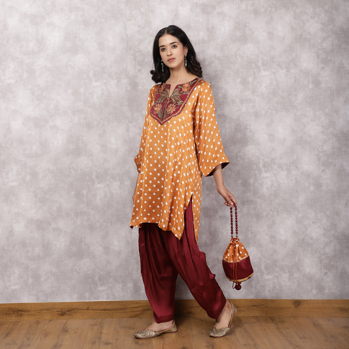 Orange Bandhani Suit Set with Hand Embroidered Yoke and Potli Bag