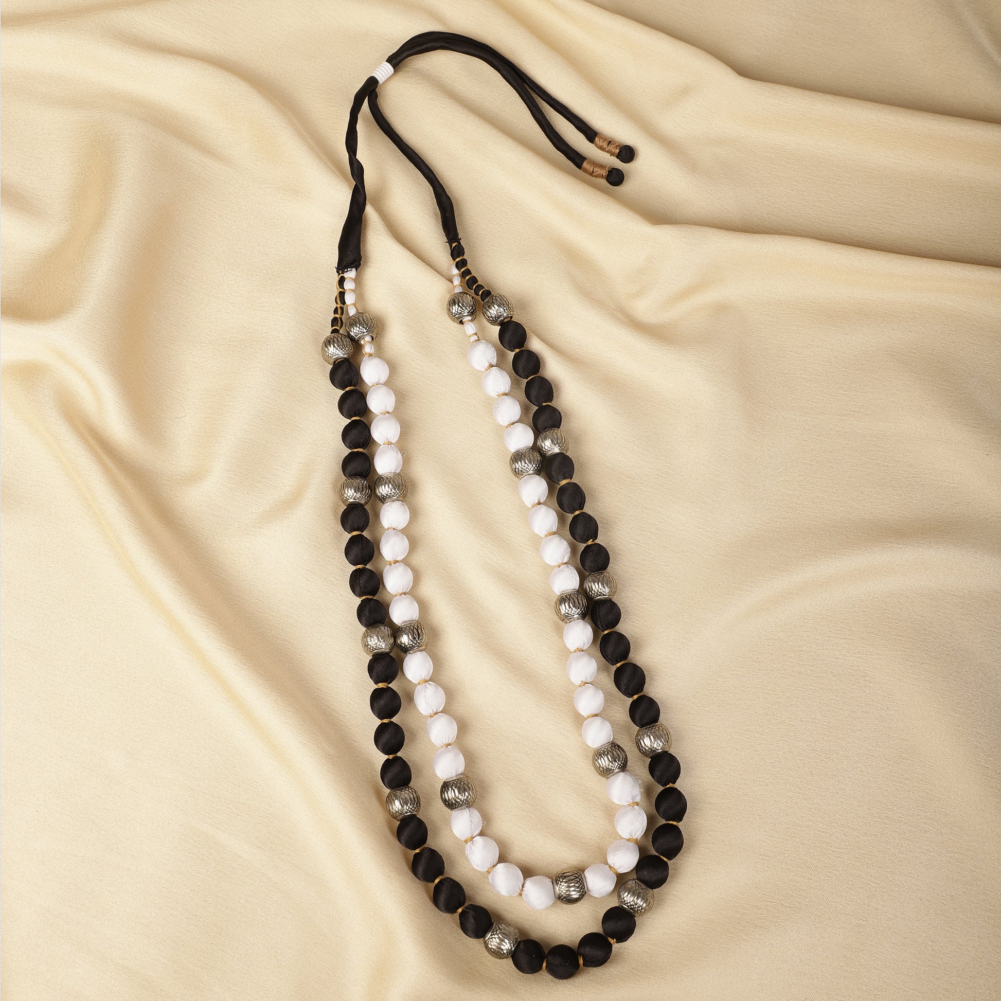 Black and white satin necklace close-up - Spring Soul