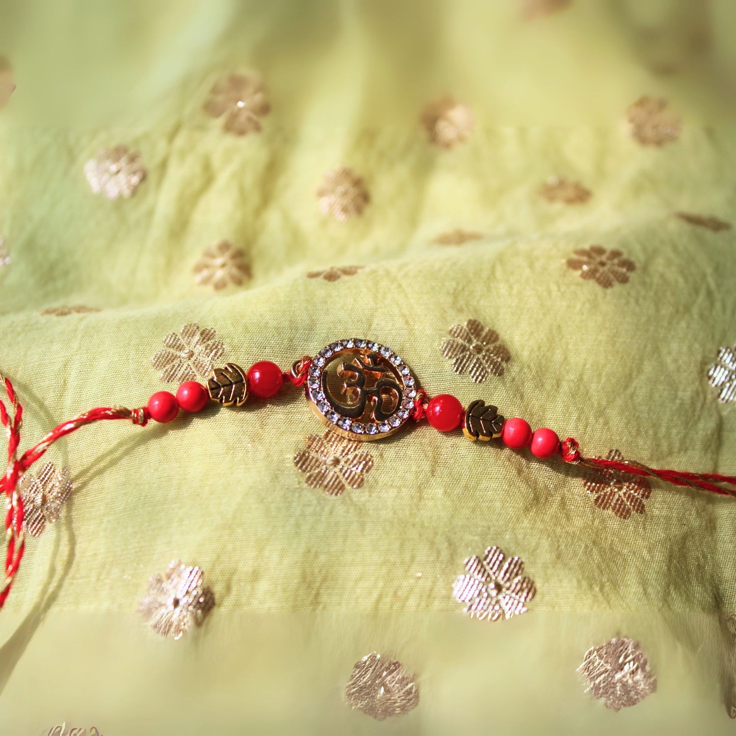 OM beaded rakhi