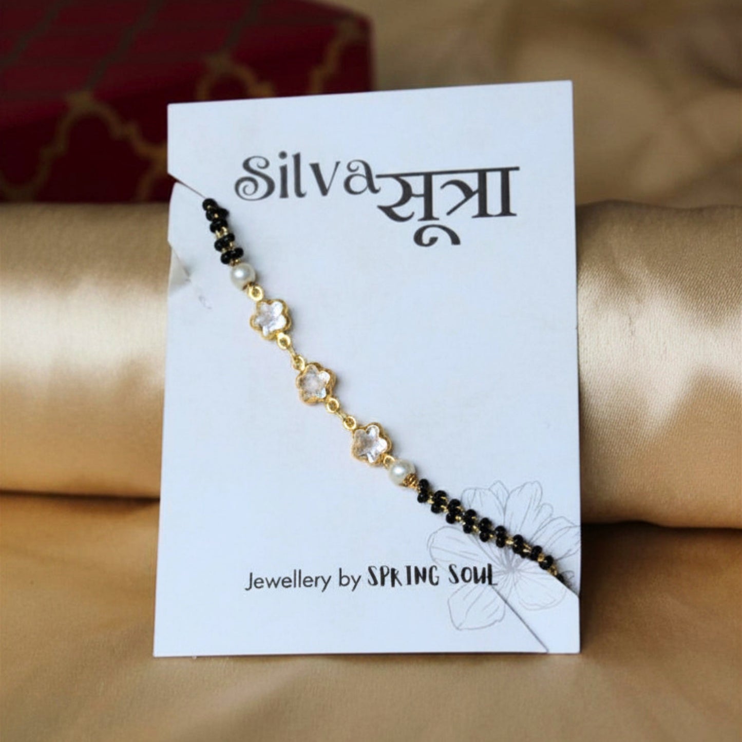 Black bead floral bracelet rakhi