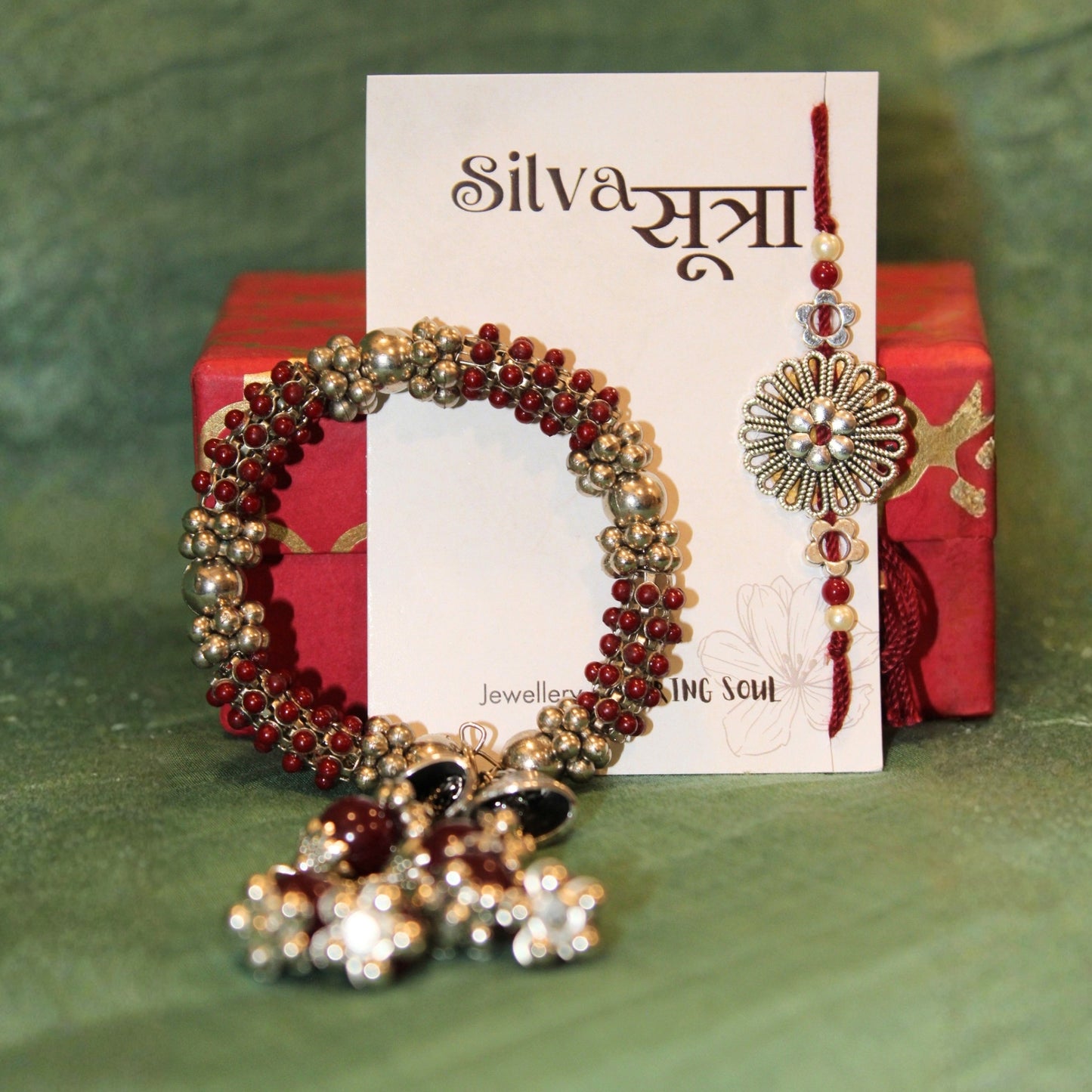 Maroon jhumkar rakhi set of 2