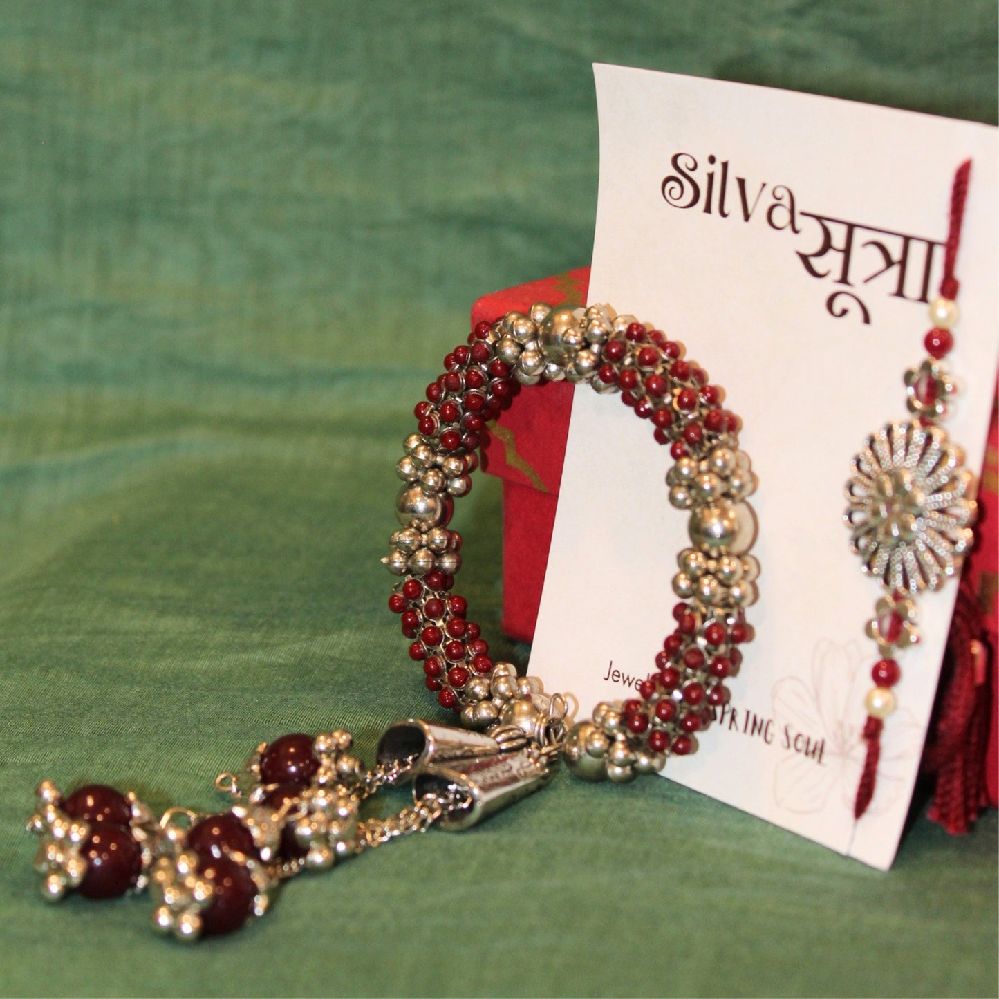 Maroon jhumkar rakhi set of 2