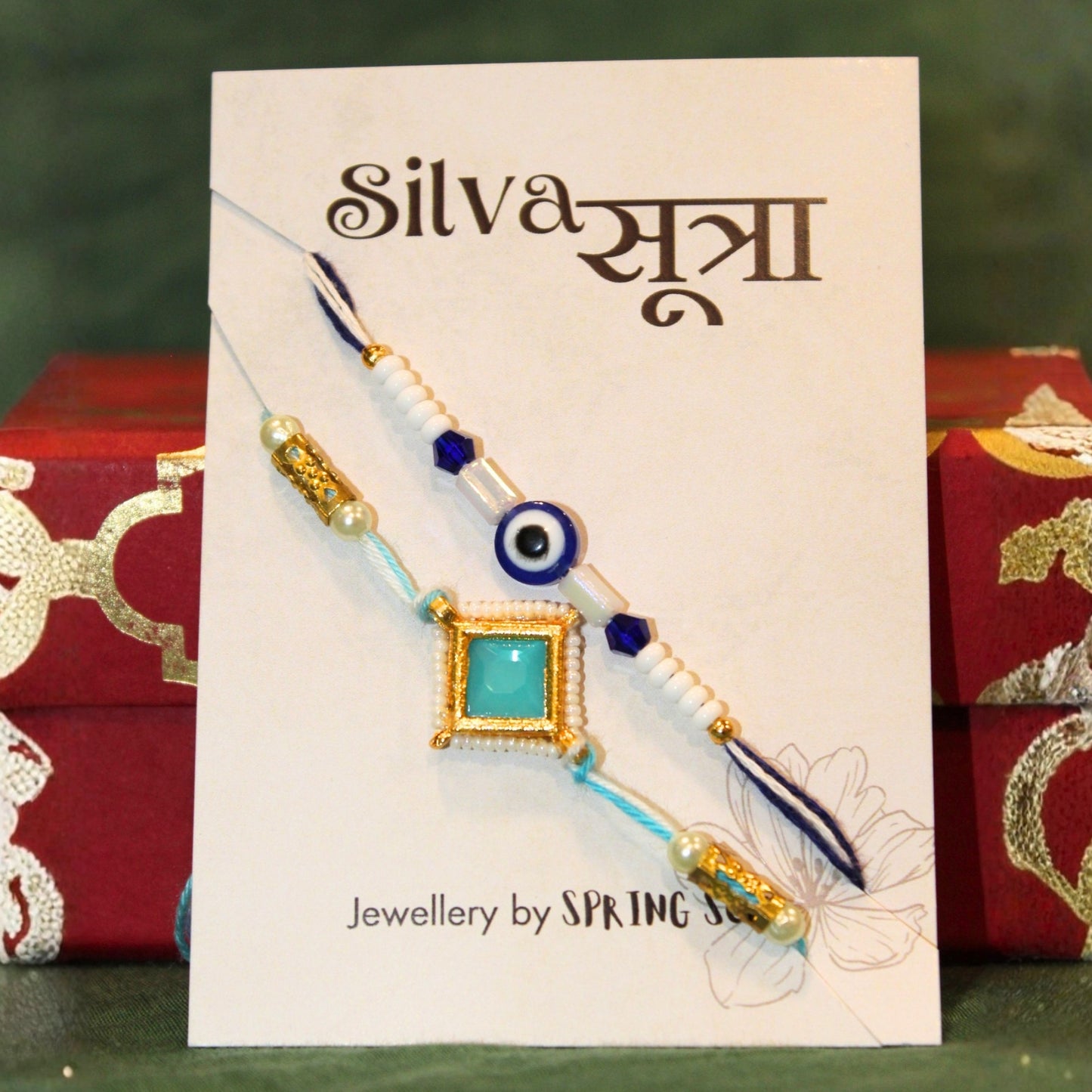 aqua evil eye rakhi set of 2