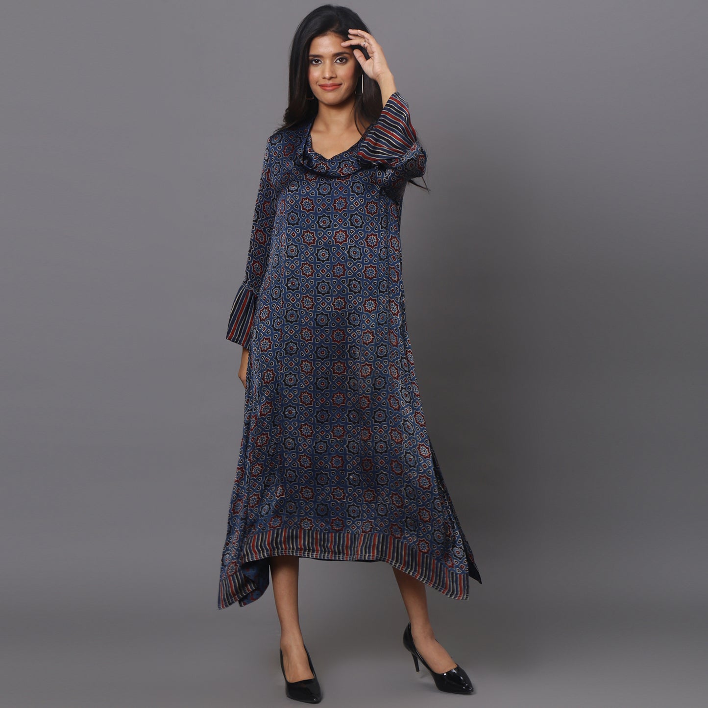 Asymetric cowl neck dress in ajrakh modal silk fabric with flared sleeves.