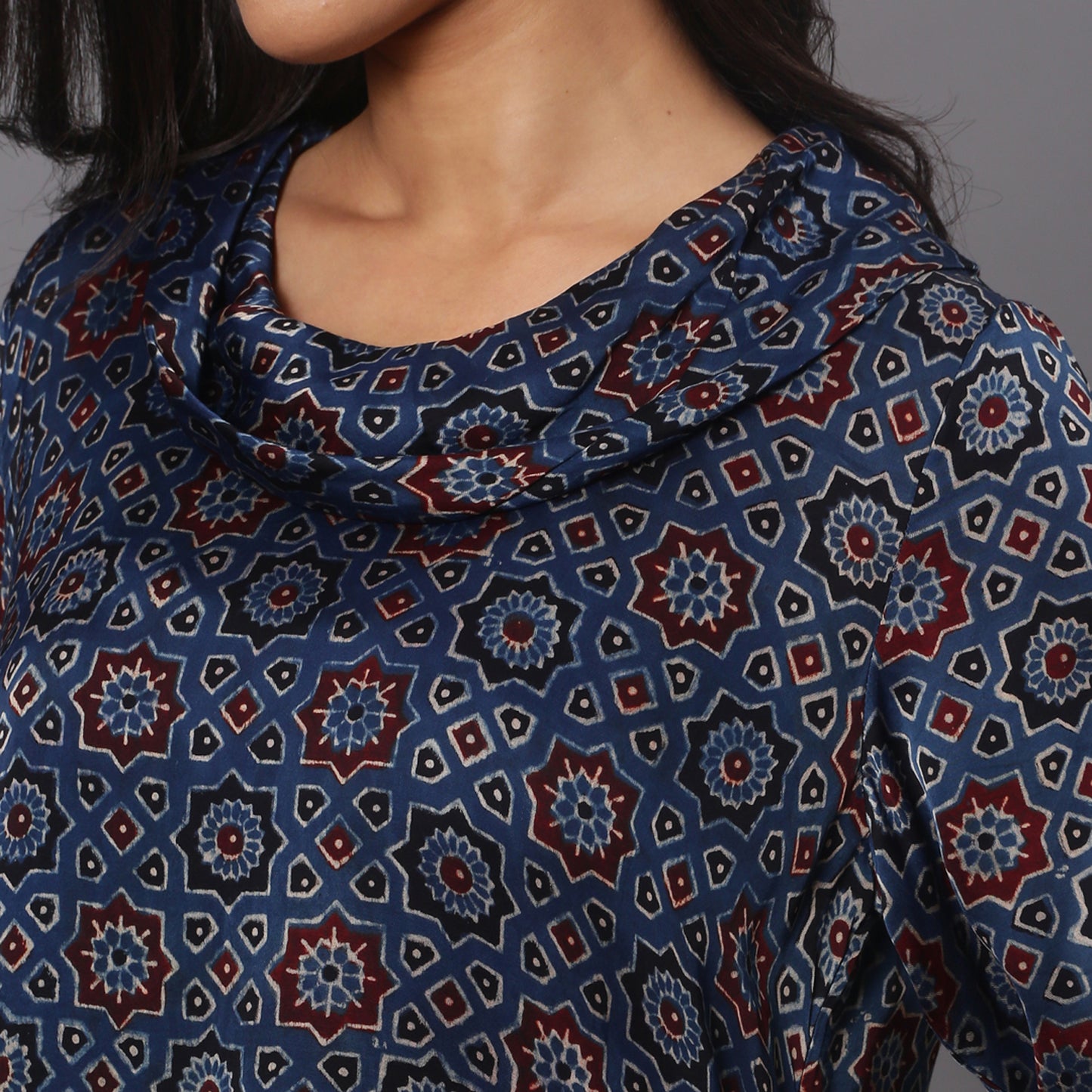 Asymetric cowl neck dress in ajrakh modal silk fabric with flared sleeves.