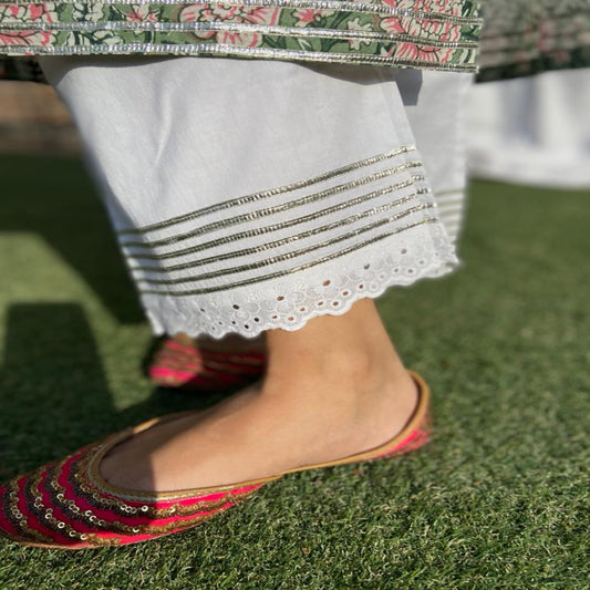 Cotton ankle pants with lace gota detailing.