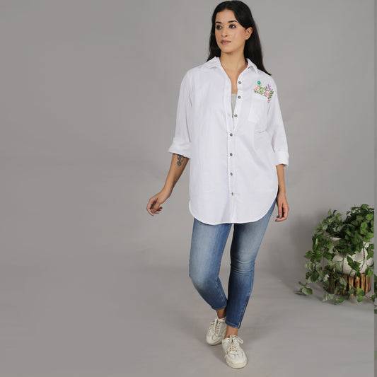 White shirt with floral embroidery on the pocket