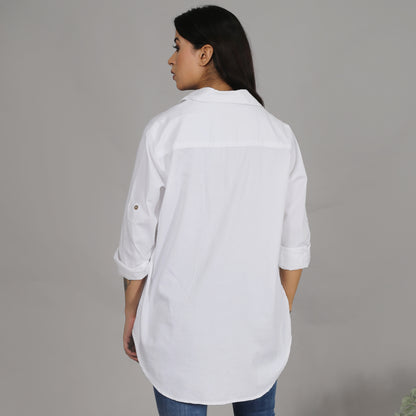 White shirt with floral embroidery on the pocket
