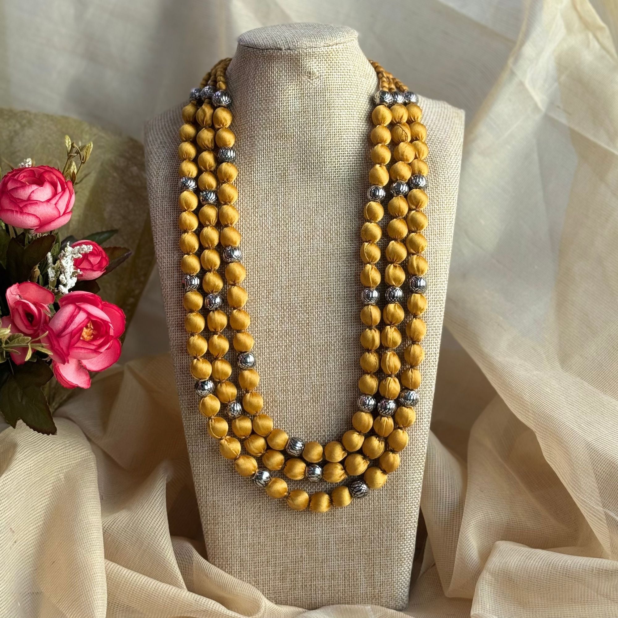 Handmade fabric beaded necklaces in various colors and designs